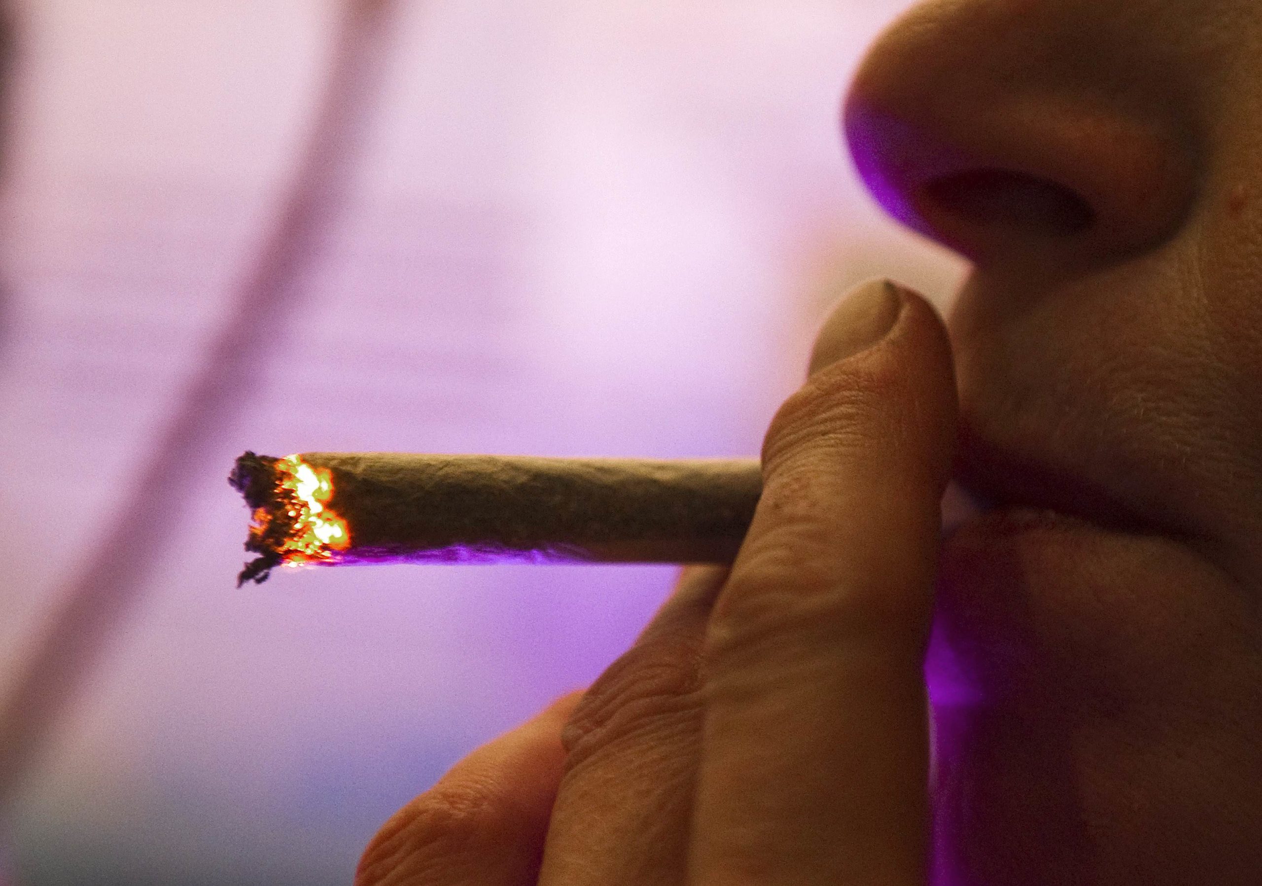 PATRON SMOKES MARIJUANA CIGARETTE IN AMSTERDAM