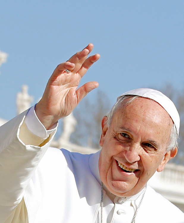Pope Francis waves as he leads weekly audience at Vatican
