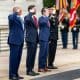 President Donald Trump greets Vice President JD Vance, Defense Secretary Pete Hegseth, Chairman of the Joint Chiefs General Dan Caine, Executive Director of the Office of Army National Military Cemeteries Karen Durham-Aguilera, commanding general of the Joint Task Force-National Capital Region and the US Army Military District of Washington Major General Trevor J. Bredenkamp and LTG Michele Bredenkamp at Arlington National Cemetery, Monday, May 26, 2025, in Arlington, Virginia
