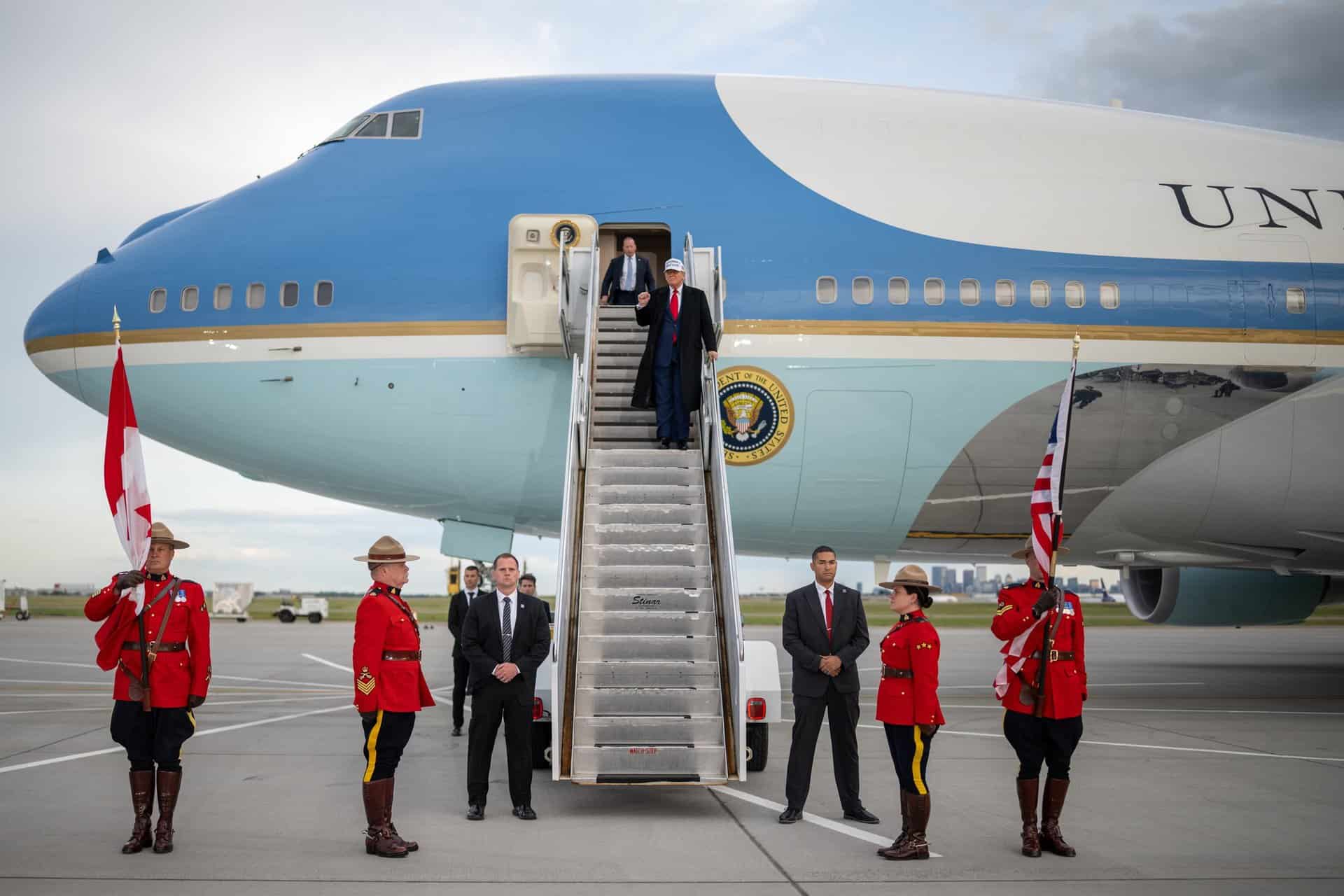 President Donald Trump disembarks Air Force One at Calgary International Airport, Sunday, June 15, 2025, en route to the G7 Summit. (